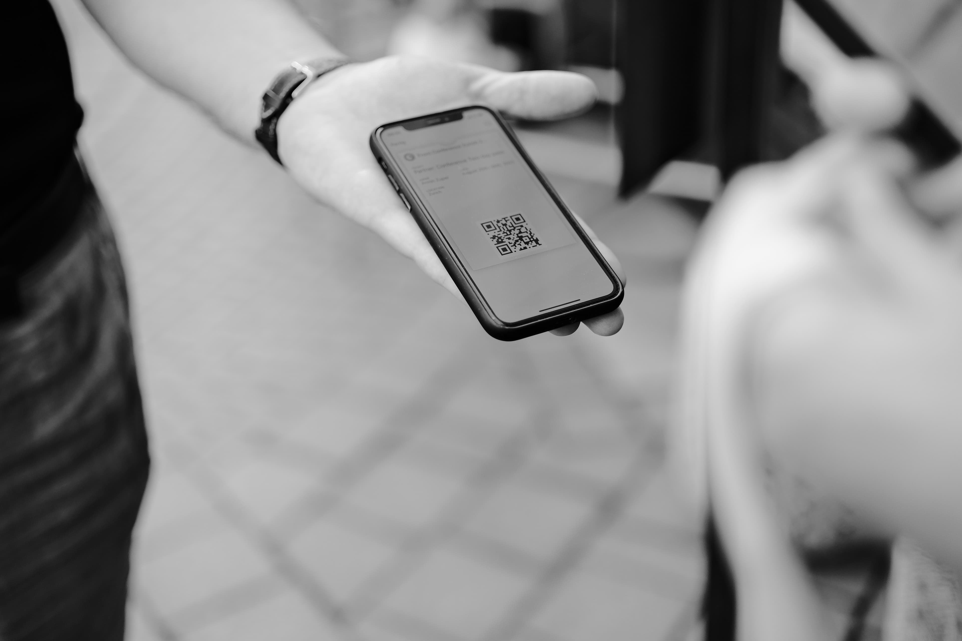 A QR code pass displayed on a phone screen